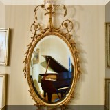 DM02. Sheraton style gilt beveled oval mirror. 53”h x 23”w 
